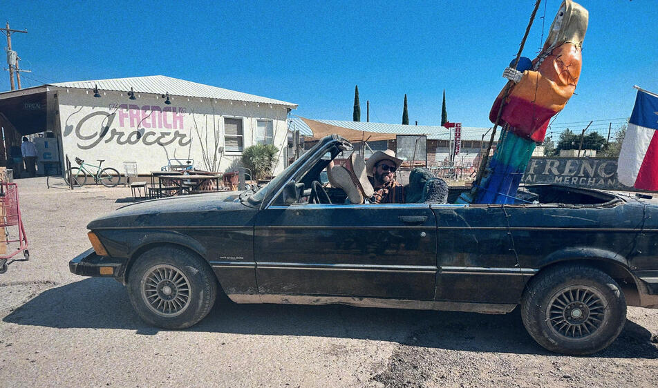 Artist, writer, and musician M. Walker performing his duties as emcee of The 5th Annual John Prine Night in Marathon, TX